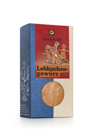 Eine Schachtel SONNENTOR LEBKUCHEN GEWÜRZ im Lebkuchendesign mit Fenster, durch das die Gewürzmischung im Inneren preisgegeben wird.