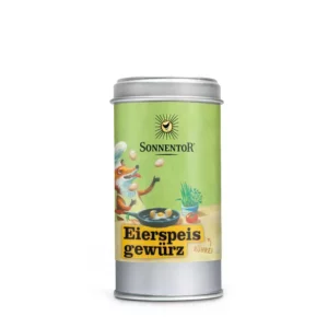 Eine Dose SONNENTOR EIERSPEIS GEWÜRZ mit grünem Etikett, das einen Fuchs mit Kochmütze beim Kochen zeigt.