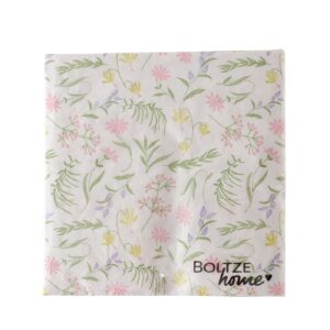 Eine quadratische Papierserviette mit dem Namen DEKO SERVIETTEN BLOSSOM, mit einem pastellfarbenen Blumenmuster und dem Aufdruck "Boltze home" in der rechten unteren Ecke.