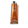 Eine Tube OCC NUIT FESTIVE HANDCREME in einem kupferfarbenen Behälter mit weißem Text und dekorativen Mustern.
