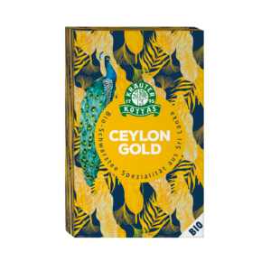 KOTTAS TEE CEYLON GOLD in der mit einem Pfauen- und gelben Blättermuster verzierten Dose, mit der deutschen Aufschrift „BIO“ als sri-lankische Schwarztee-Spezialität.