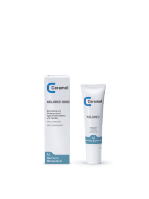 Die CERAMOL KELORED-Tube und -Box werden auf einer weißen Oberfläche präsentiert und weisen Verpackungsdesigns mit blauem und grünem Text und Grafiken auf.