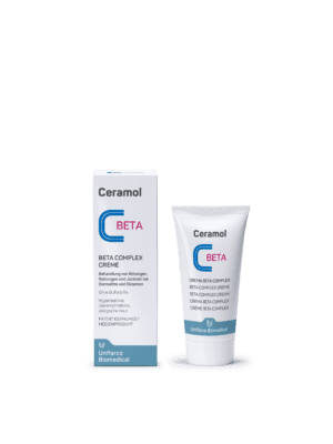 Eine Tube und eine Schachtel CERAMOL BETA COMPLEX CREME mit blauem und rotem Branding auf weißem Hintergrund und Produktdetails in verschiedenen Sprachen.