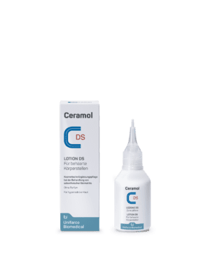 CERAMOL LOTION DS Flasche und Schachtel auf weißem Hintergrund. Der deutsche Text auf der Schachtel enthält Produktinformationen und Anwendung für behaarte Körperbereiche.