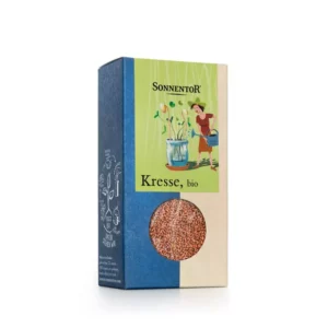 Eine Schachtel Bio-Kressesamen von SONNENTOR BIO KRESSE mit farbenfrohem Branding und einem kleinen Fenster, durch das die Samen sichtbar sind.