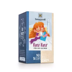 Schachtel SONNENTOR TEE KUTZ-KUTZ-Tee mit der Illustration eines rothaarigen Kindes mit Brille und Schal, das eine Tasse hält.