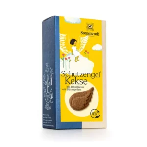 Schachtel SONNENTOR KEKS SCHUTZENGEL mit einem Engel mit Flügeln und dekorativen Illustrationen auf der Vorderseite, gefüllt mit Bio-Dinkelkeksen mit Blütenpollen.