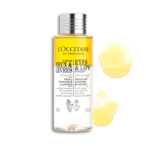Eine Flasche Make-up Entferner für Augen & Lippen Immortelle & Ringelblume von LOccitane mit einer kleinen Menge Flüssigkeit daneben.