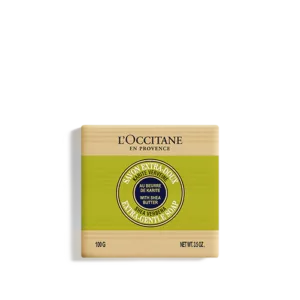 Bild des Seifenstücks Shea Seife Verveine LOccitane en Provence, mit Sheabutter, grünem Etikett, 100 g, mit extra sanfter Seife in einem kreisförmigen Muster.