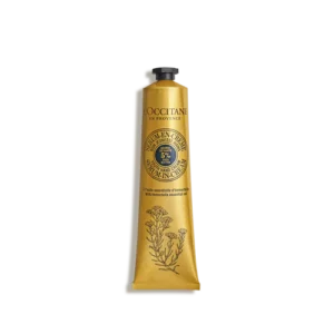 Gelbe Tube Immortelle & Shea Anti-Aging-Handcreme von LOccitane en Provence mit Blumenmuster und schwarzer Kappe.