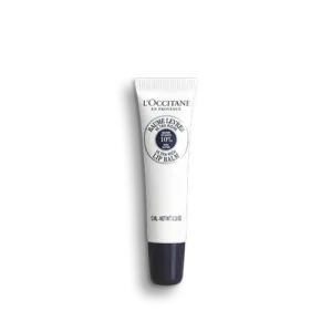Eine weiße Tube LOccitane en Provence SHEABUTTER LIPPENBALSAM mit dunkler Kappe, blauem Text und Logo.