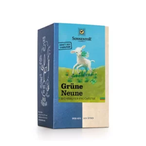 Eine Schachtel Sonnentor Grüne Neune Bio-Kräuter-Früchtetee kommt in einer blau-beigen Verpackung mit der Illustration einer weißen Ziege auf grünen Hügeln.