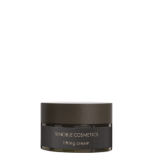 Vor einem weißen Hintergrund steht ein Tiegel mit dunkelbrauner Lifting-Creme von Vinoble Cosmetics.