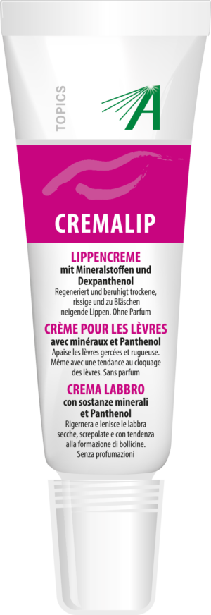 Eine Tube SCHUESS CREMALIP ADL Lippencreme mit mehrsprachigem Text und einem Top-Applikator.