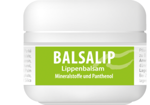 Ein weißes Glas mit der Aufschrift „SCHUESS BALSALIP ADL“ auf grünem Hintergrund und einem Text mit detaillierten Angaben zu Inhaltsstoffen wie Mineralien und Panthenol.