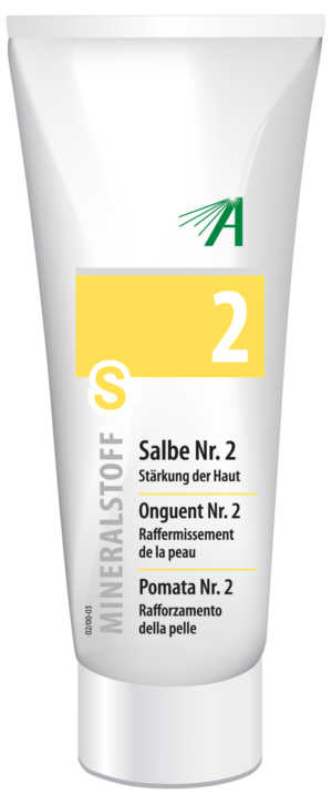 Tube mit „SCHUESS SLB NR 2 ADL“-Salbe auf weißem Hintergrund, mit gelbem Etikett und Text in Deutsch, Französisch und Italienisch, der die hautstärkenden Eigenschaften hervorhebt.