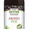 Auf einer Flasche mit der Aufschrift „ARONIA SFT PUR 100 BIO“ sind Abbildungen von Aroniabeeren zu sehen und das Etikett weist darauf hin, dass das Produkt aus biologischem Anbau und aus Österreich stammt.