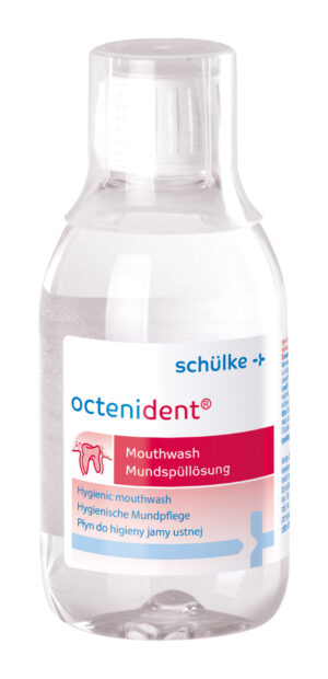 Eine Flasche OCTENIDENT MUNDSPUEL-LSG Mundwasser von Schülke+ hat einen weißen Verschluss, ein rotes Etikett und einen mehrsprachigen Text.