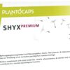 Schachtel mit dem Nahrungsergänzungsmittel PLANTOCAPS SHYX PREMIUM KPS mit Pflanzenstoffen, Cholin, Phenylalanin, B-Vitaminen und Vitamin C; Löwenzahnmotiv an der Seite.