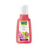 Das SH.RAUSCH MALVEN VOLUMEN Shampoo kommt in einer Flasche mit rosa Flüssigkeit, verziert mit einer Blumenillustration und ist speziell für feines Haar geeignet.