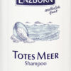 SH.TOT MEER ENZBORN MILD ist in einer weißen Flasche mit blauen Akzenten erhältlich und weist mit einem deutschen Text auf die beruhigenden Eigenschaften bei gereizter Kopfhaut und die Eignung bei Neurodermitis und Schuppenflechte hin.