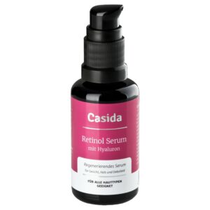 Eine Flasche RETINOL SER mit Hyaluron von Casida, ausgestattet mit einem Pumpspender und rosa Etikett.