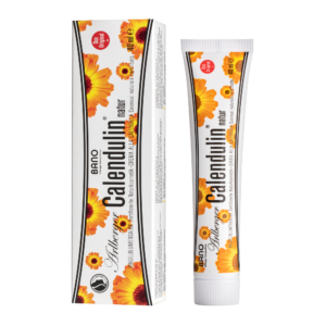 Eine Tube CALENDULIN NATRUE RINGEL.SLB-Creme neben ihrer Schachtel, verziert mit Bildern von Ringelblumen und hervorgehobenen natürlichen Inhaltsstoffen.