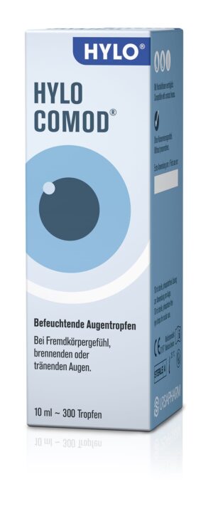 Die HYLO-COMOD AU-TR Augentropfenpackung ist mit einer Augengrafik, einem blau-weißen Design und einem deutschen Text versehen, der die feuchtigkeitsspendende Wirkung bei gereizten Augen hervorhebt. Die Packung enthält 10 ml, also ungefähr 300 Tropfen.