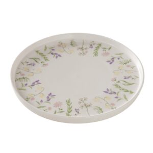 Ein weißer Keramikteller mit einem floralen Muster aus grünen Blättern und violetten und rosa Blüten am Rand.