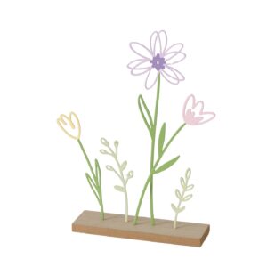 Dekoratives Ornament aus Metall und Holz mit pastellfarbenen Blumen und Blättern auf einem Holzsockel.