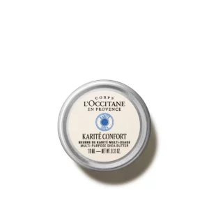 Eine kleine Dose L'Occitane en Provence Karité Confort Mehrzweck Sheabutter, 10 ml, von oben gesehen auf weißem Hintergrund.